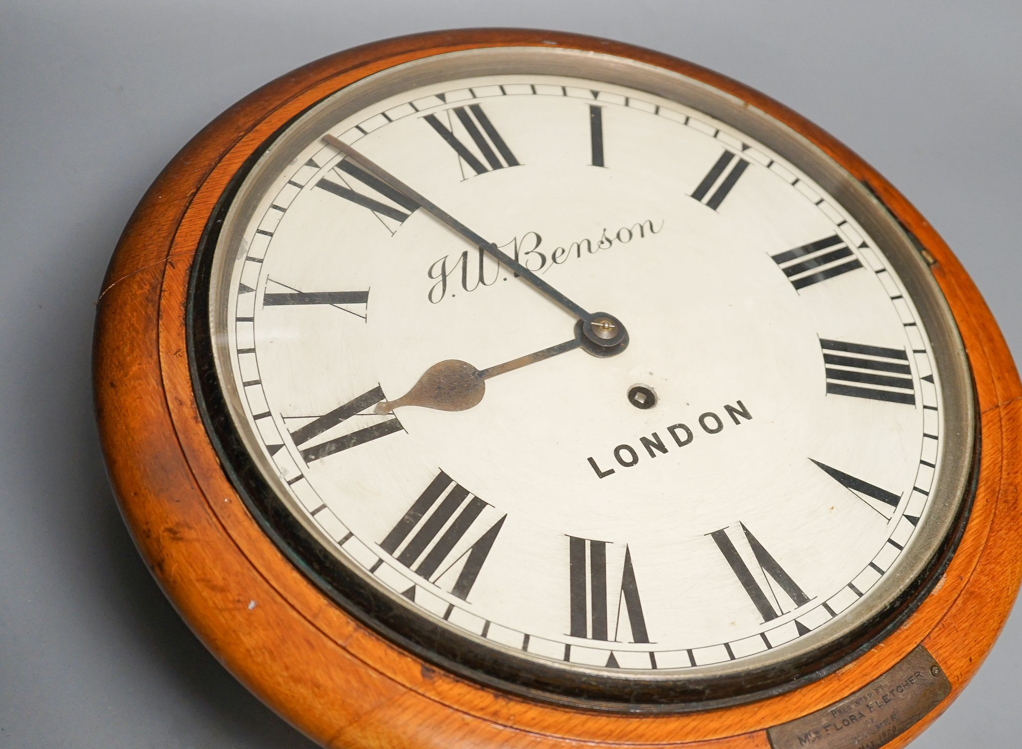 A Victorian oak-cased dial clock, signed JW Benson, London, 38 cms diameter.